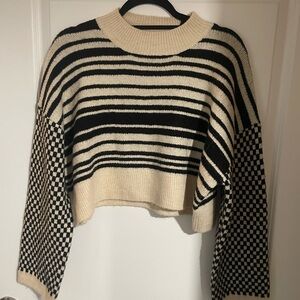 Elegant Black and Cream Striped Sweater